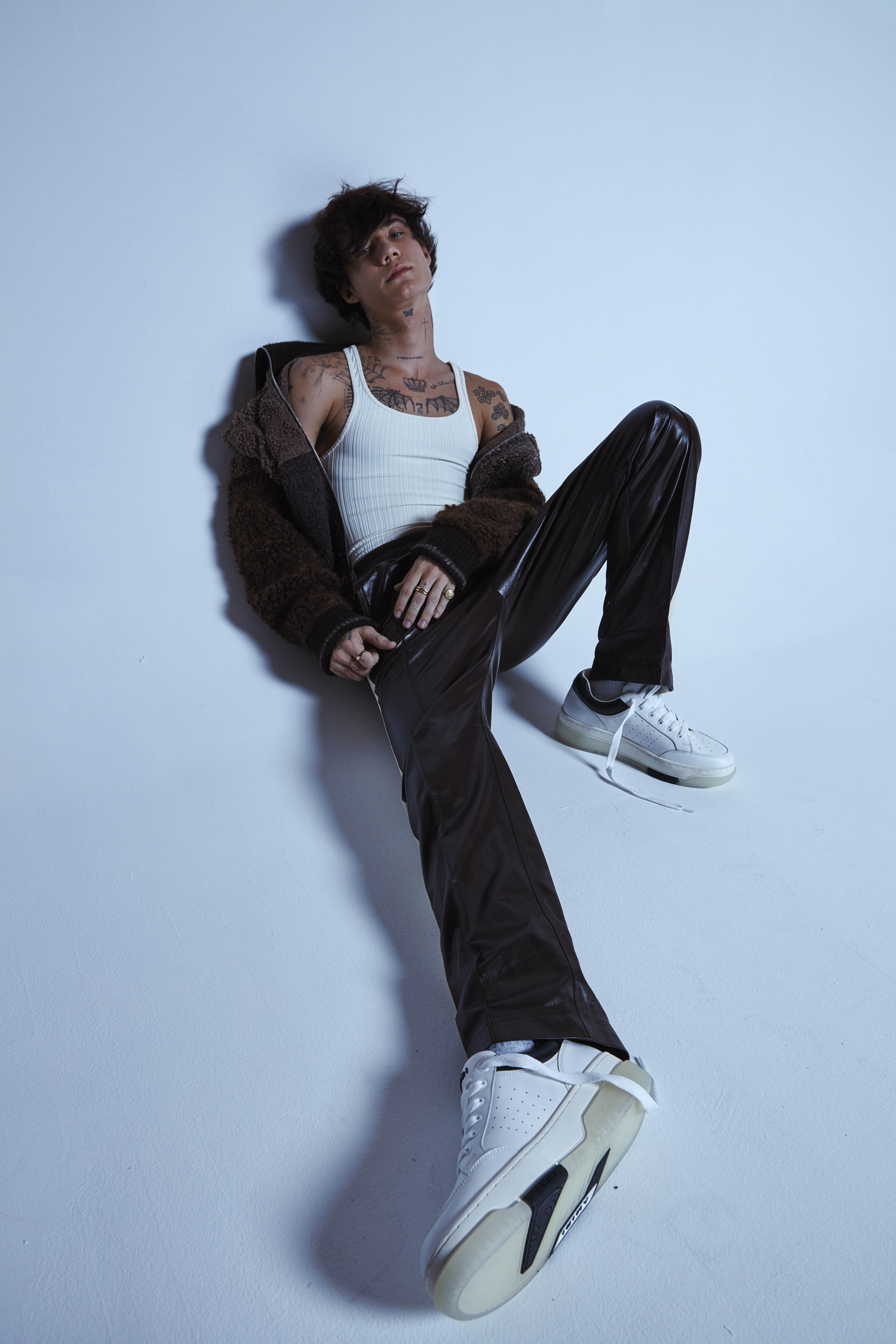 An aerial view of waves crashing against a shore.