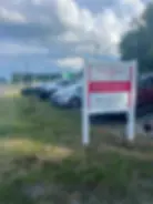 Beck & Roane available real estate services sign in lot