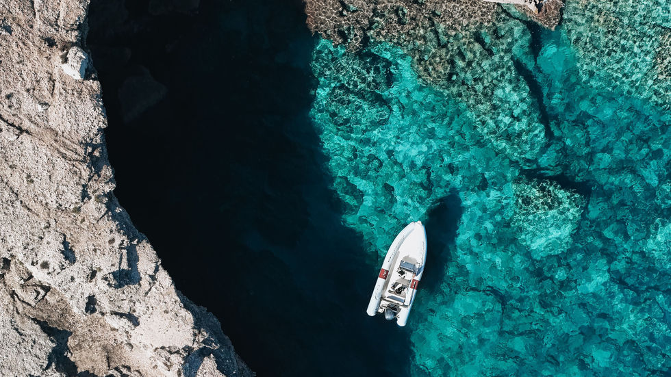 Joker Boat 26 Clubman | Exclusive boat tour from Cala Gonone along the Gulf of Orosei and Baunei Coast, exploring hidden coves, caves, and crystal-clear waters.