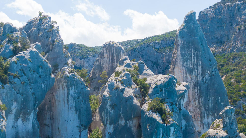Joker Boat 26 Clubman | Exclusive boat tour from Cala Gonone along the Gulf of Orosei and Baunei Coast, exploring hidden coves, caves, and crystal-clear waters.