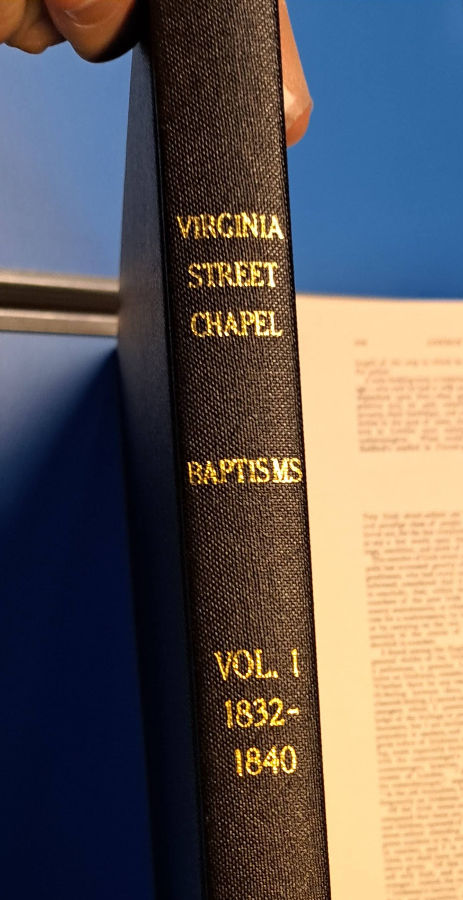 A photograph of the bound book of the Virginia Street Chapel Baptism Register, Vol 1, 1832-1840 (Photographed in Tower Hamlets Archives, February 2024)