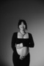 A pregnant woman wearing black