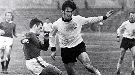 Sports Club of the Capital Still: Archival photograph of footballer Kazimierz Deyna running on the pitch.