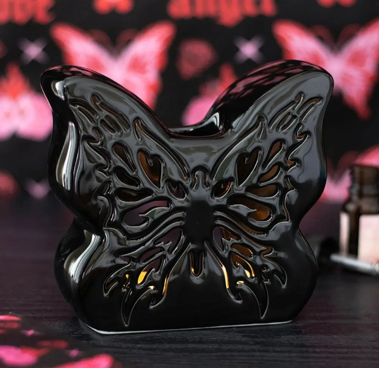 Brûleur d'huile papillon découpé noir