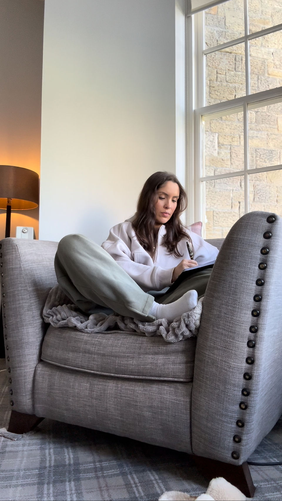 Girl journalling reflecting on her gut healing journey