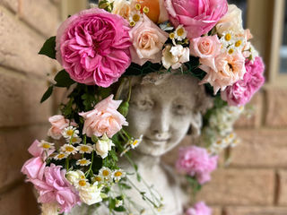 Garden Lady adorned with Heritage Roses