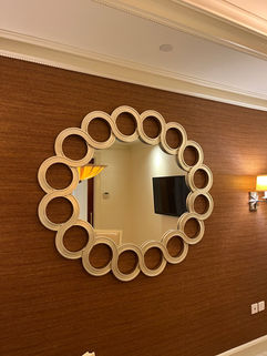Round mirror with decorative frame