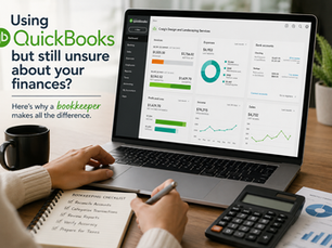 Business owner reviewing QuickBooks financial reports on a laptop while organizing bookkeeping tasks and financial documents in a professional office setting.