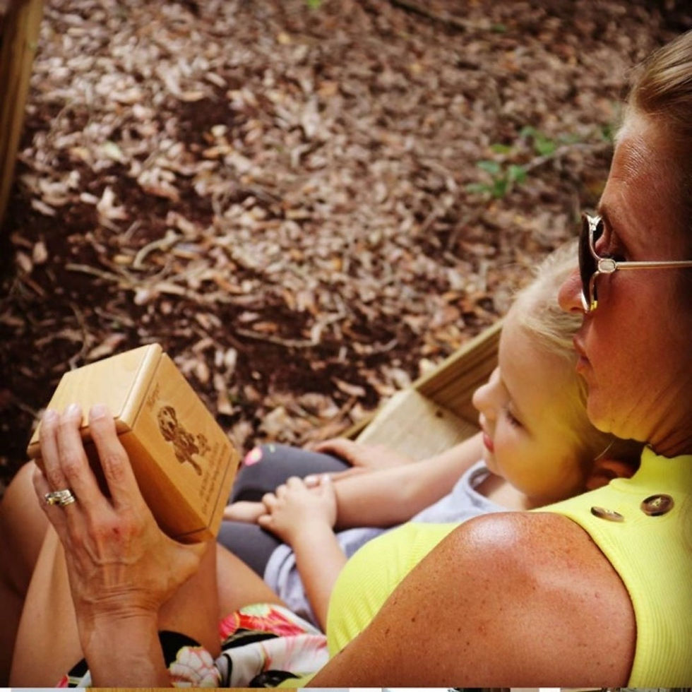 Thumbnail: Mother daughter share viewing pet cremation urn
