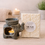 Thumbnail: Grey elephant ceramic wax burner, lit candle, ELIXAIR Coffee Vanilla wax melts