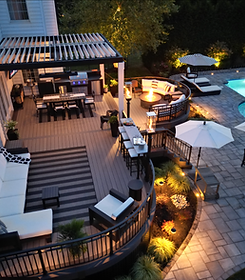 view of a backyard with custom lighting all around