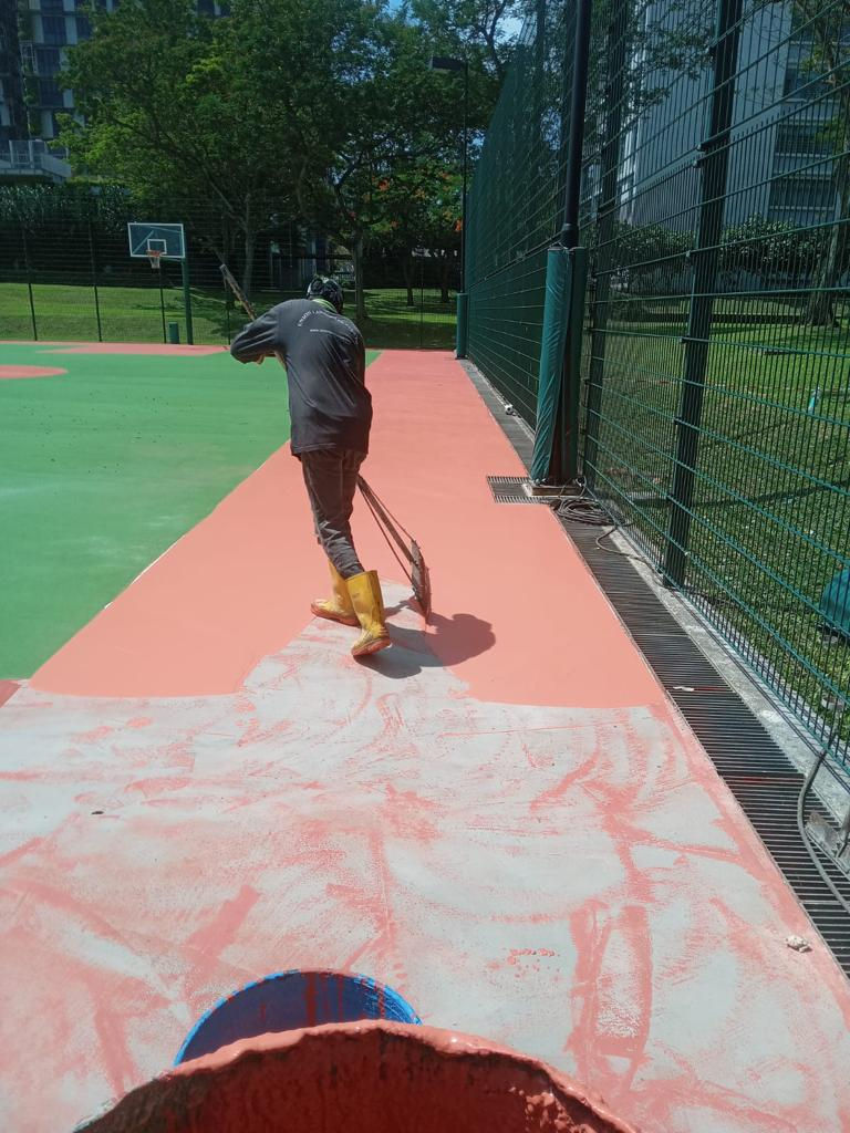ULS Technician Laying Running Track