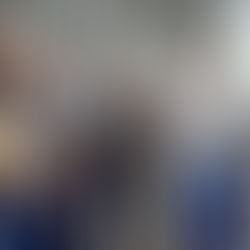 group of workers talking about numbers on a bulletin board