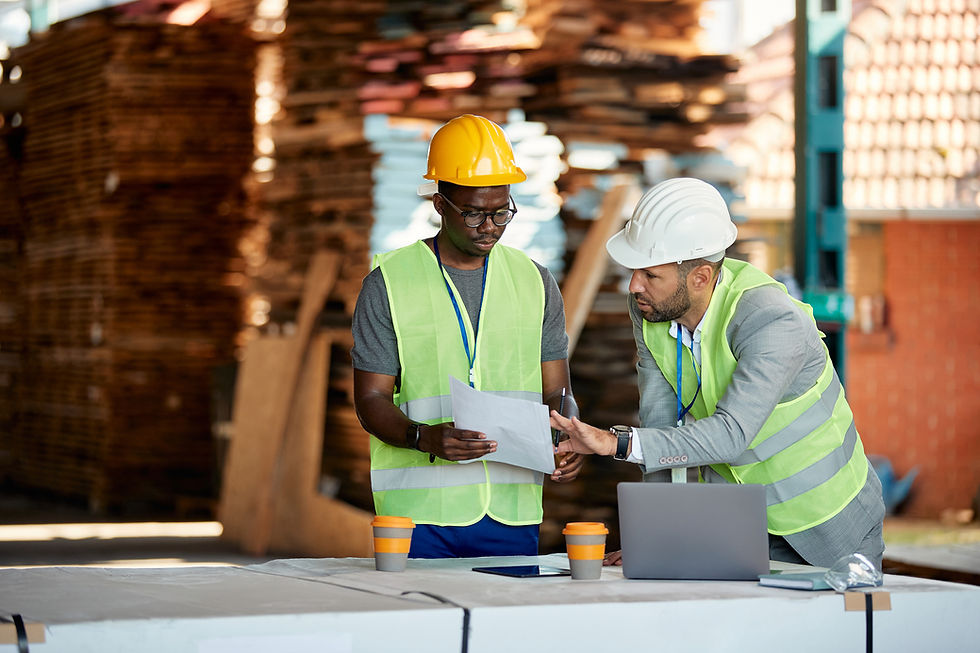 Construction guys talking about a piece of paper