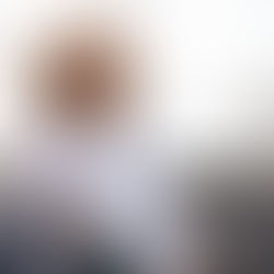 young woman in casual dress wear looking into the sky while walking down stairs outdoors