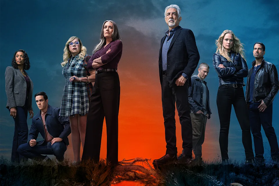 A diverse group of eight people stand confidently under a dramatic blue and orange sky, displaying determination and unity.