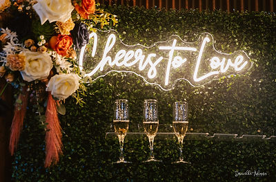Cheers to Love Sign on champagne wall
