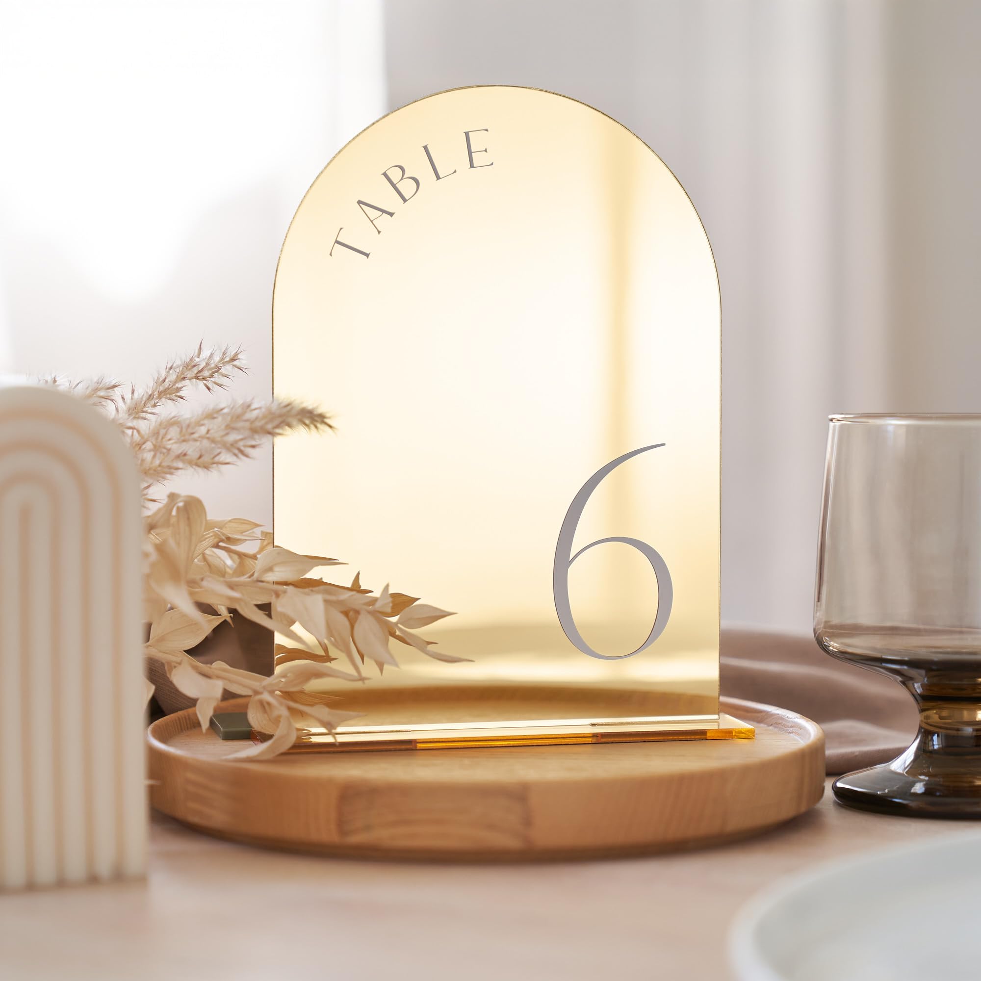 White Gold Mirrored Arch with White Text Acrylic Table Numbers 1-15 table numbers rental for weddings, showers, birthdays and corporate events