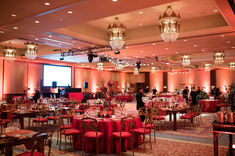 Omni Montelucia Wedding with gold and red chairs, red linen and copper chargers and flatware