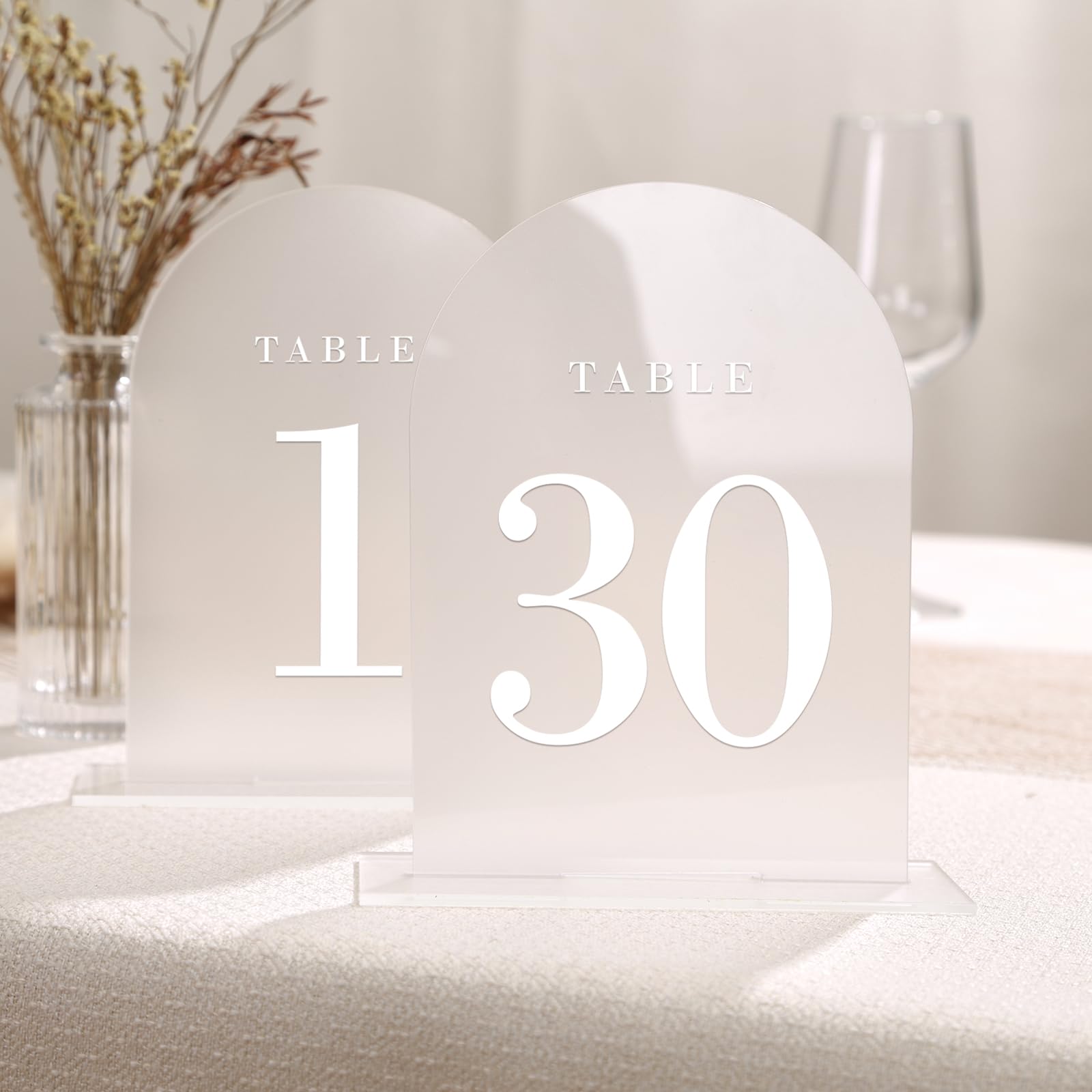 White Frosted Arch with White Text Acrylic Table Numbers table numbers rental for weddings, showers, birthdays and corporate events