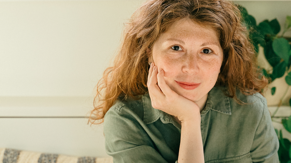 Picture of Julia, looking at the user with a serene smile on her face