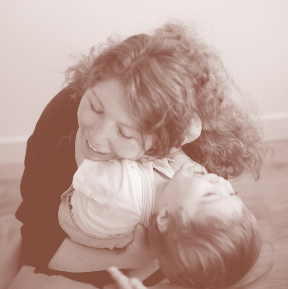 Julia hugging her child
