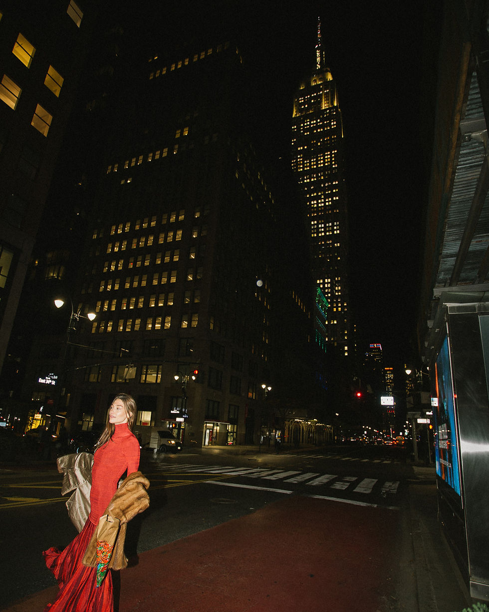 delilah dougan models in new york city, holding a bouquet of flowers that is an art piece by Amelia C. Williams.  