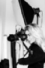 Photographer in studio using photography equipment