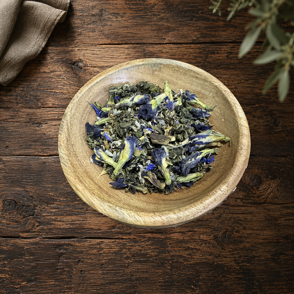 Real Fairy Lemonade loose tea blend in the original wooden bowl on a warm wood table