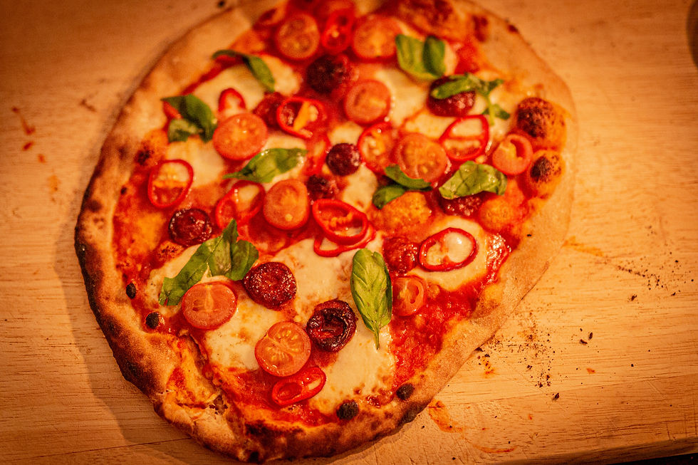Wood-fired pizza with mozzarella, chorizo, tomatoes, chilli & basil