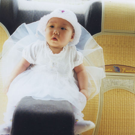 sitting in the car wearing white dress.jpg
