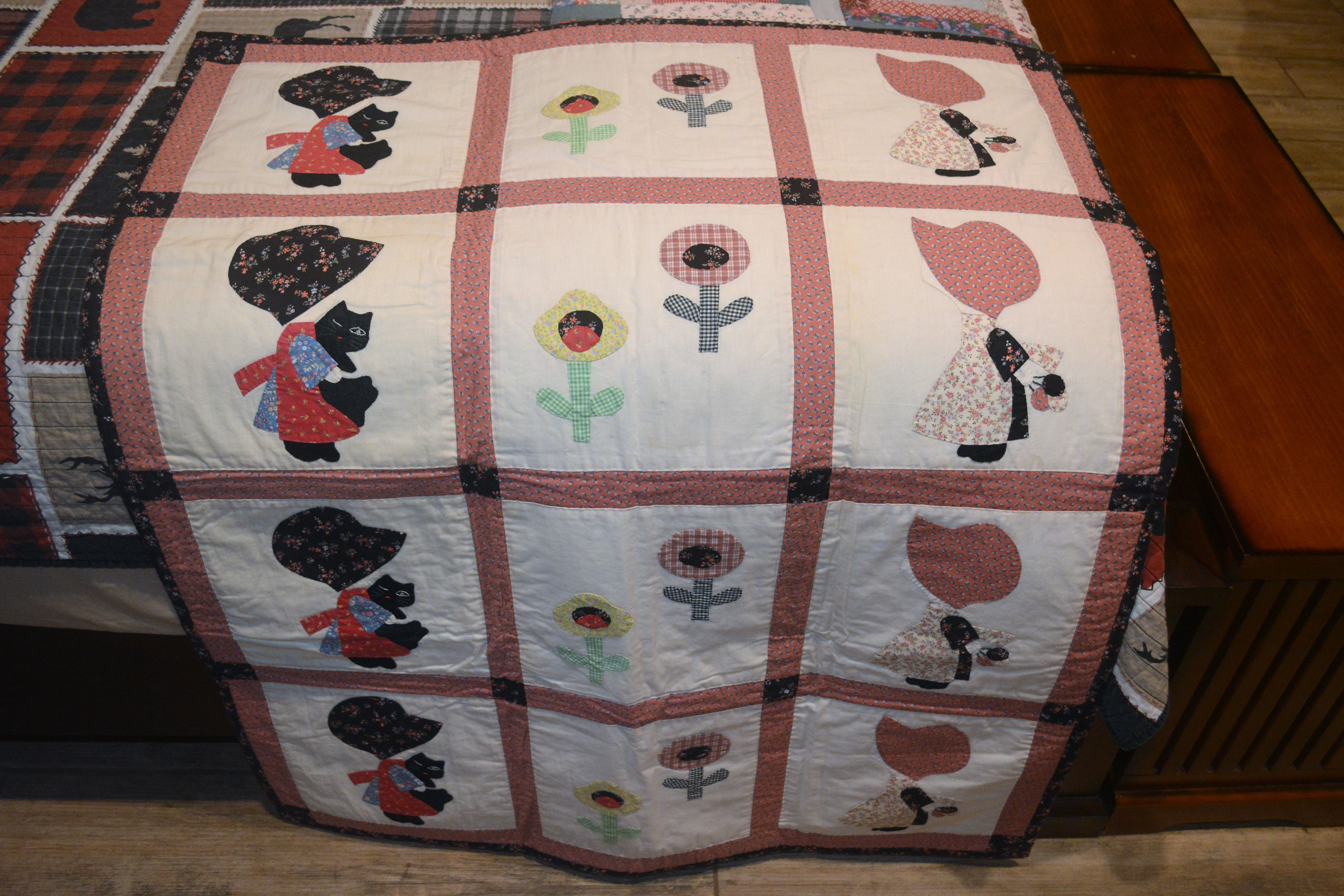 Vintage handmade lap or wall quilt with Sunbonnet Sue