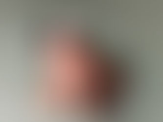 Mother kissing baby’s head during milestone photography session