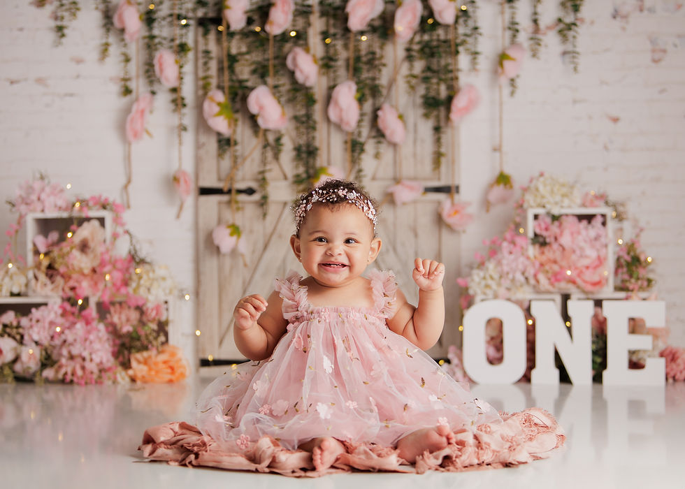 baby enjoying a colorful cake smash session photographed by professional cake smash photographer in Coral Springs Florida