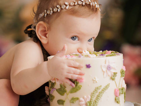 Baby girl smashing pink cake in luxury Deerfield Beach studio