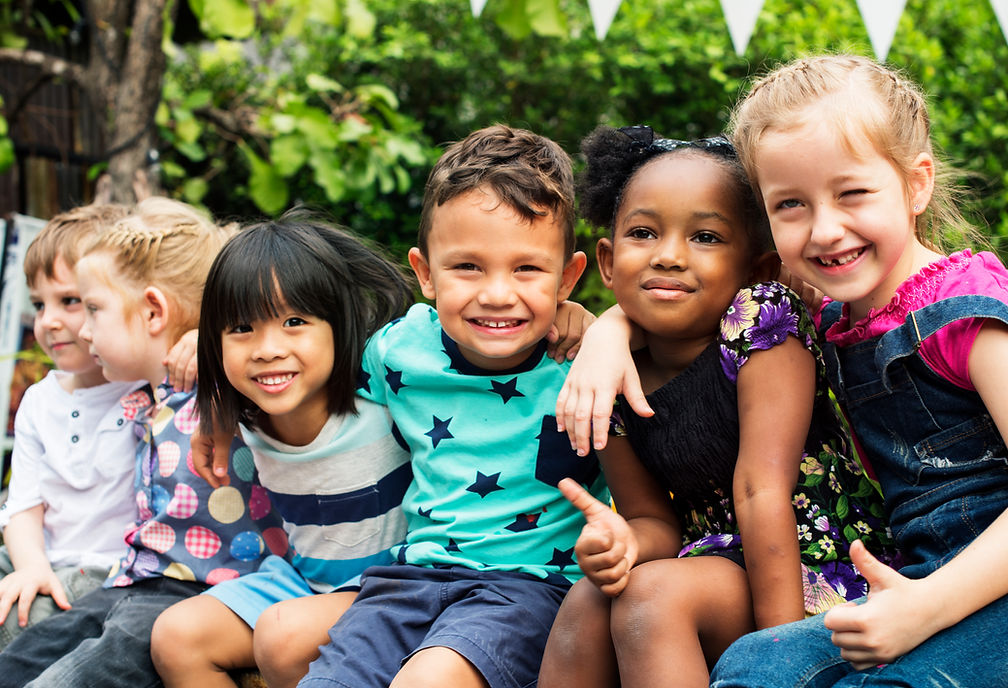 group-kindergarten-kids-friends-arm-around-sitting-smiling-fun.jpg