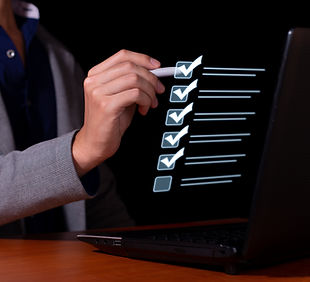 Businessman marks the checklist for document control, online product quality and business