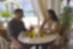 Shangri La Le Touessrok Mauritius - Coco's Beach house couple at table smiling.jpg