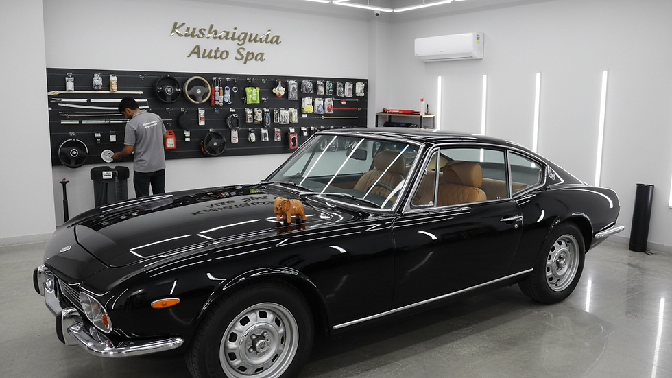 Eye-level view of a clean and shiny car at a detailing studio in Kushaiguda