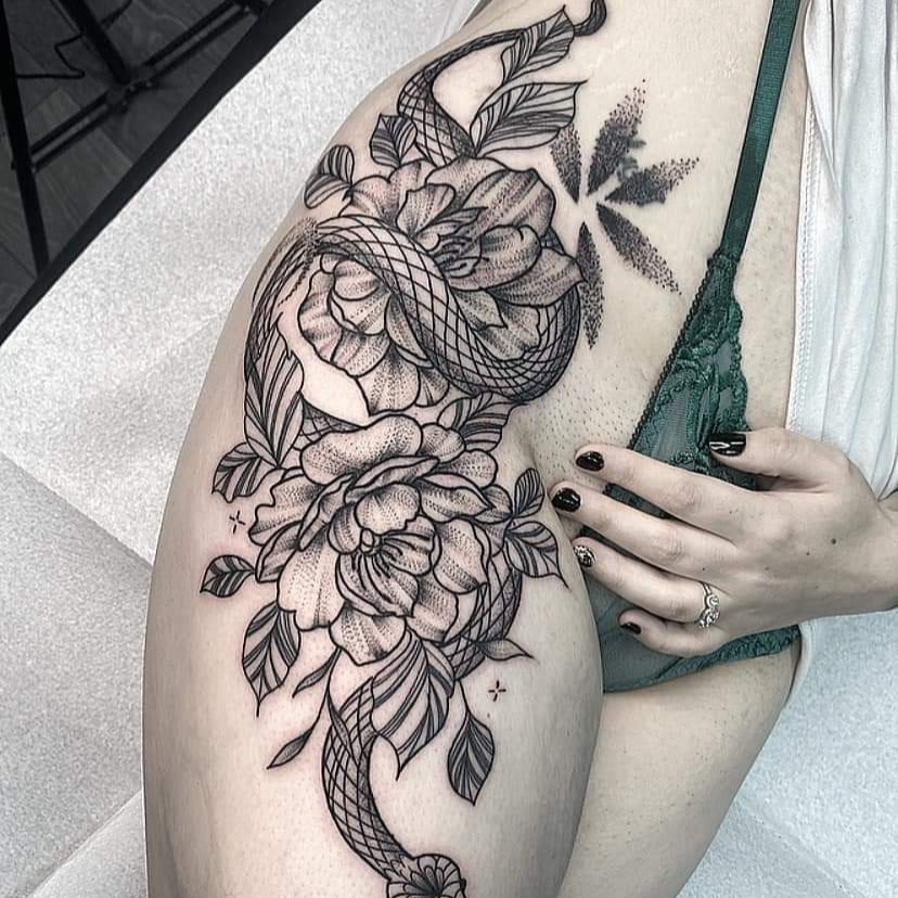 Detailed black-and-grey serpent and peony tattoo from the Inkglorious portfolio