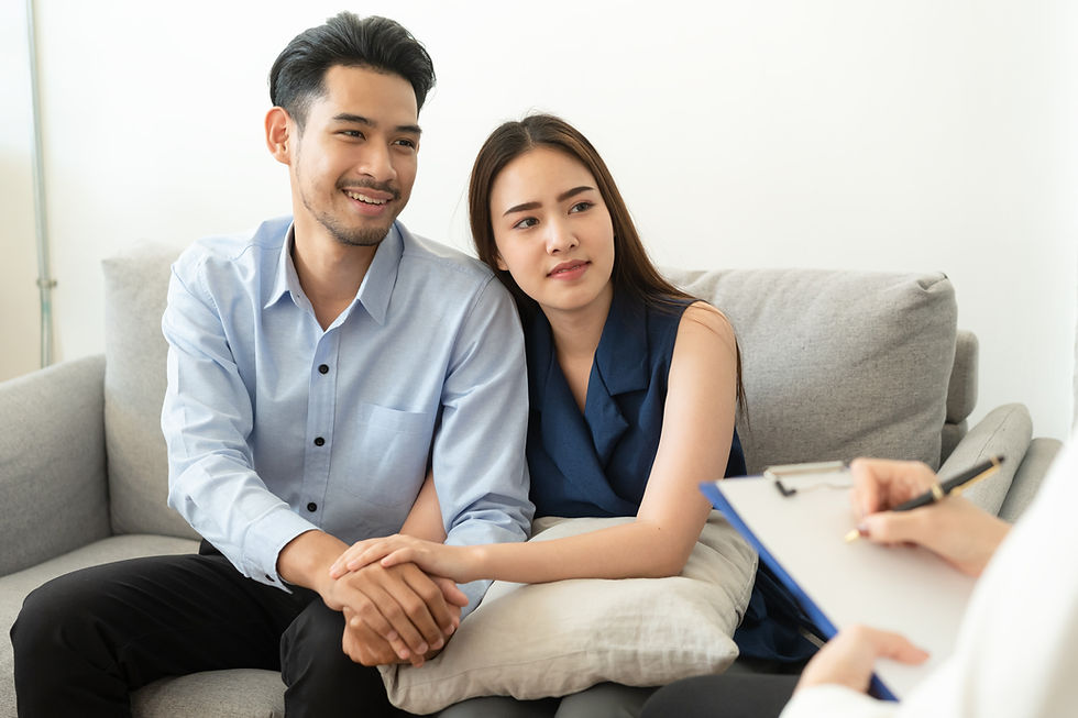 Man and woman sitting on a couch looking at a lady with a clip board and pen. This represents the need for couples counseling katy, tx and marriage counseling katy, tx 77494. It also represents the need for couples therapy katy, tx and marriage therapist katy, tx 77494.