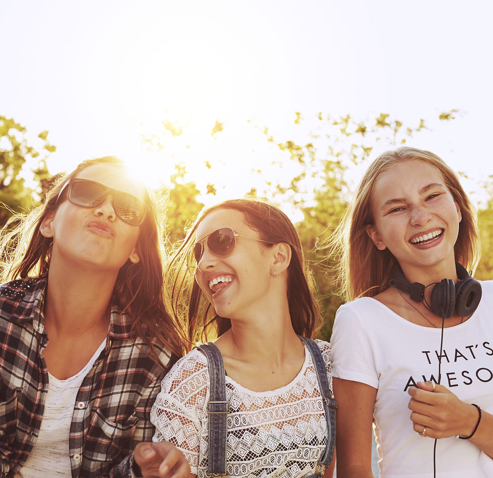 Three teenager girls, outside, with the sun behind them, smiling and laughing. This represents the need for anxiety treatment katy, tx and neurofeedback in houston, tx. This also represents the need for ptsd treatment katy, tx and neurofeedback for anxiety houston texas.