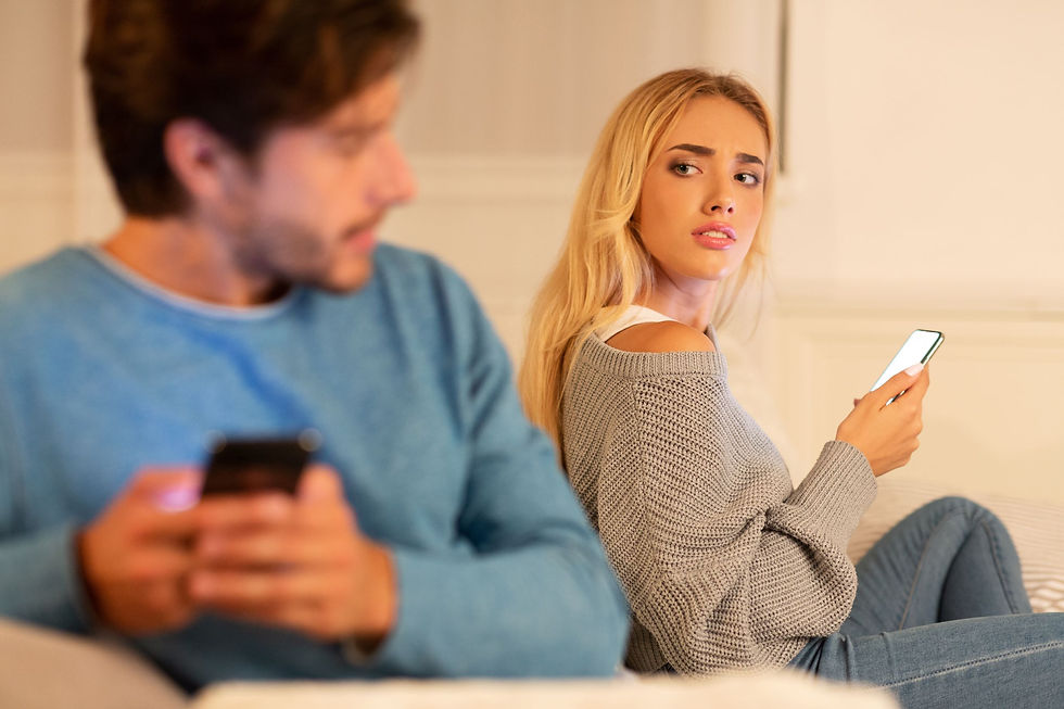 A couple argueing and looking at their phones. This represents nuerofeedback therapy in Katy TX 77494 or marraige counseling in Katy TX 77494. Also anger management counseling in Katy TX 77494