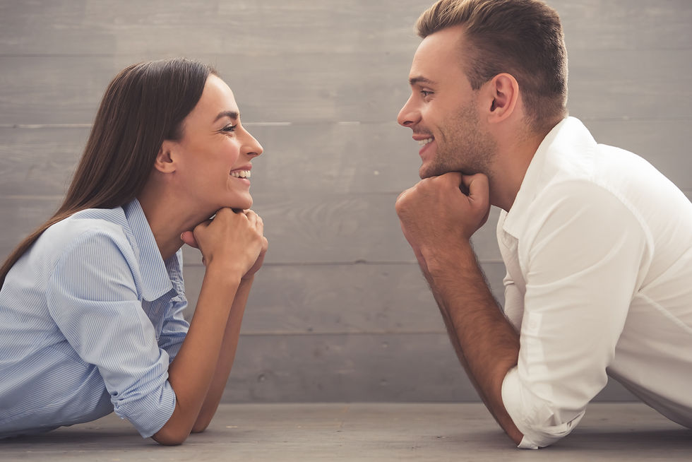 man and woman laying on the floor resting their head on their fists as their elbows are bend touching the floor and they are smiling. This represents the need for marriage counseling katy, tx with a marriage counselor katy, tx 77494. This also represents the need for marriage therapy katy, tx with a marriage therapist katy, tx 77494.