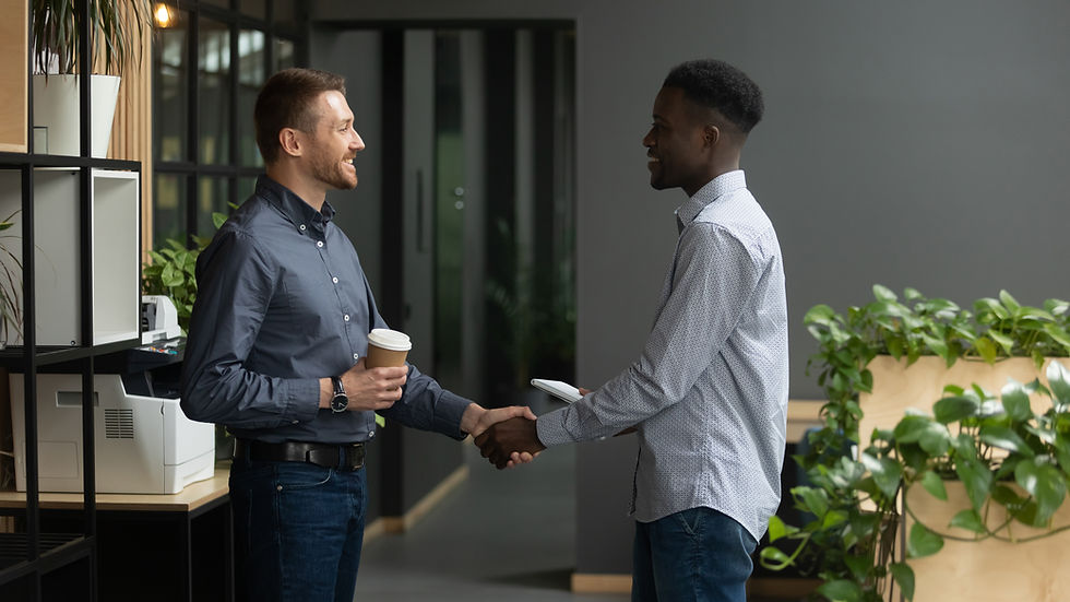 White male shaking the hand of a black male. Represents teen depression counseling in katy tx. Also represents neurofeedback for ptsd houston tx.