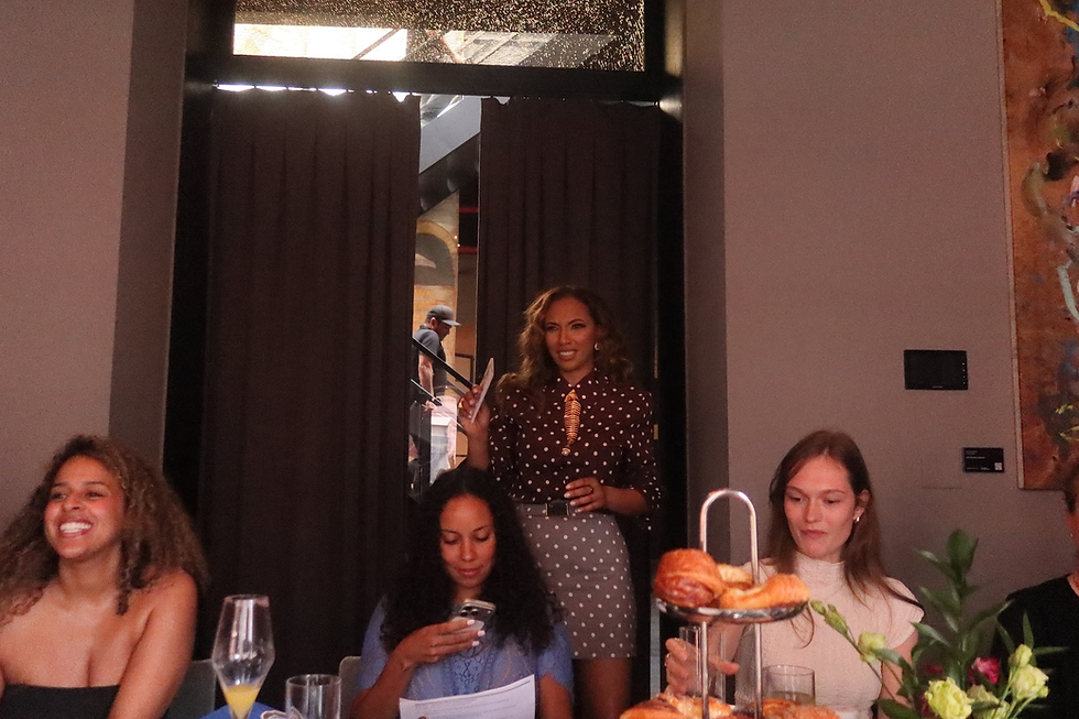 Angelina Darrisaw facilitating at a women's leadership brunch at Zero Bond
