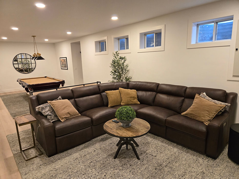 Finished modern basement with sectional sofa and pool table