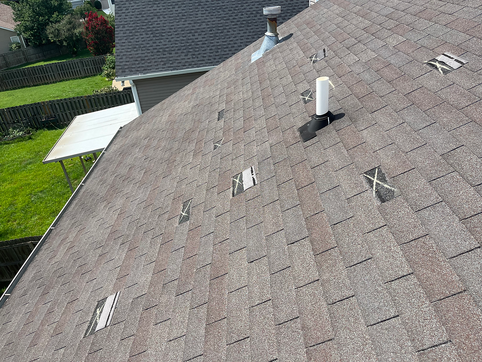 damaged shingles on a residential roof