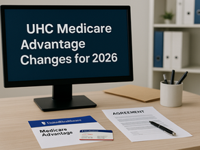 Office desk with a computer screen displaying “UHC Medicare Advantage Changes for 2026,” next to a UnitedHealthcare Medicare Advantage folder, ID card, and an agreement document, representing upcoming 2026 plan and service area changes.