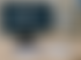 Office desk with a computer screen displaying “UHC Medicare Advantage Changes for 2026,” next to a UnitedHealthcare Medicare Advantage folder, ID card, and an agreement document, representing upcoming 2026 plan and service area changes.